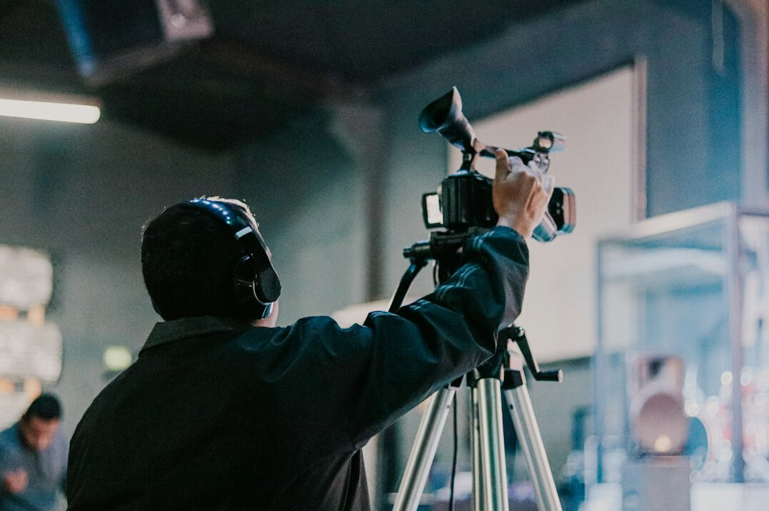 filmmaker holding camera on set